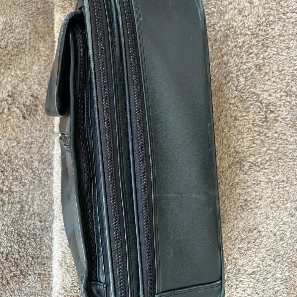 Wilson’s Black Leather Carry on Luggage.